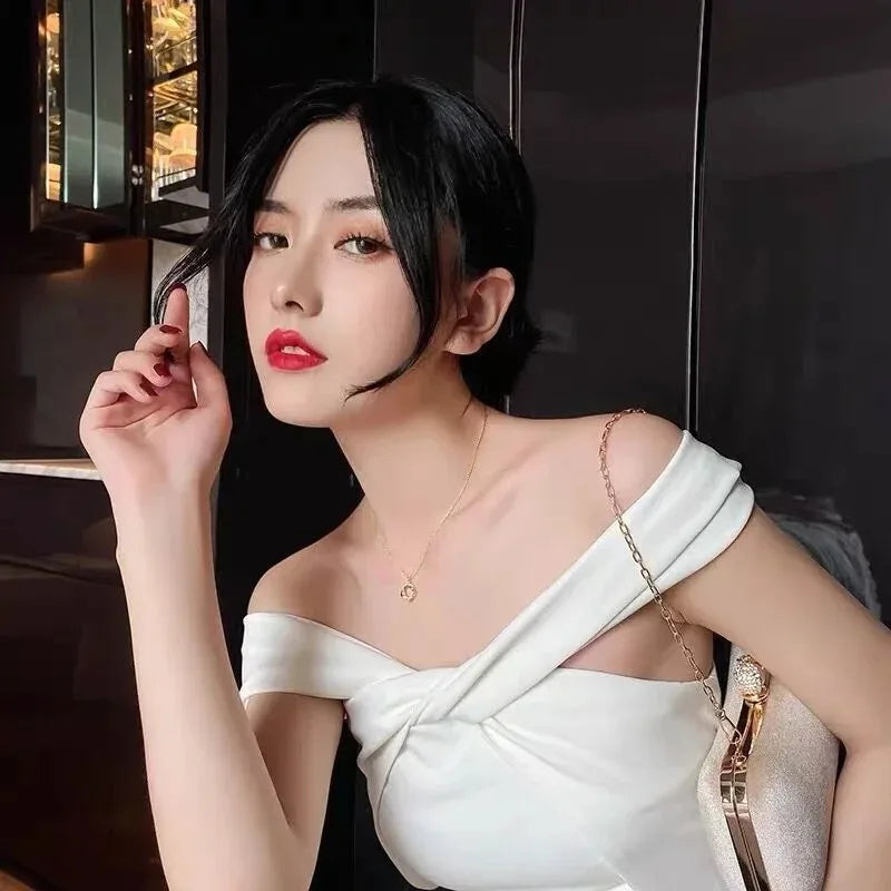 The 14k Gold Rotating Cross Pendant Necklace